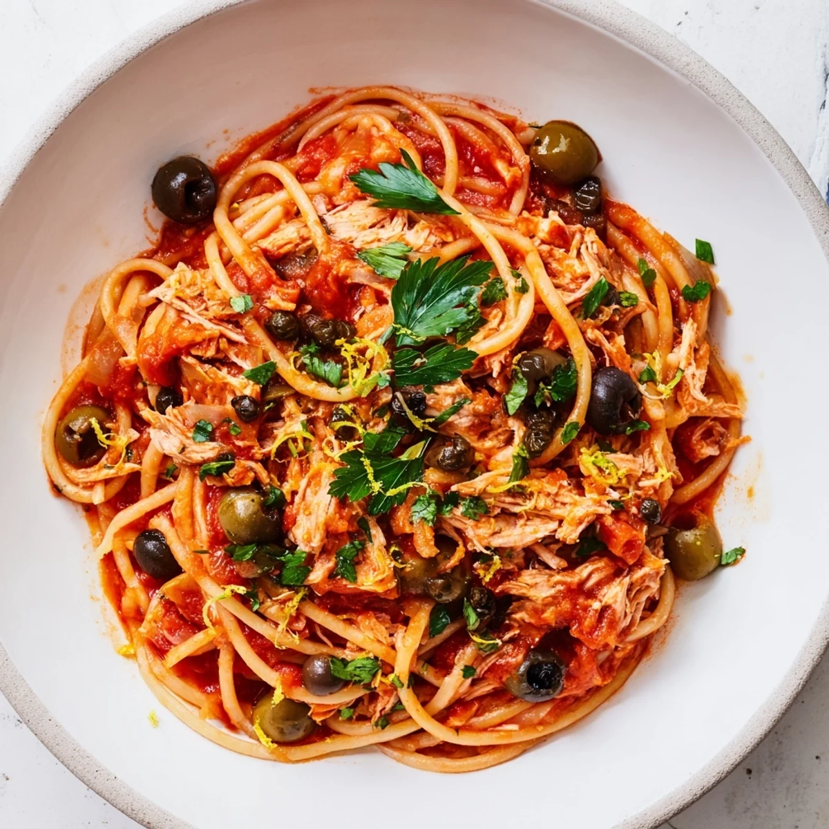 Pasta with Tuna, Olives & Capers: A close-up shot of the finished pasta, bursting with flavor and color.