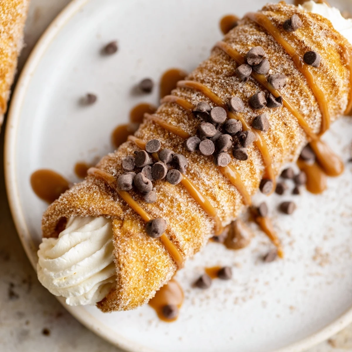 Enjoy the sweet scent of cinnamon as the churro cones are filled with smooth cheesecake.