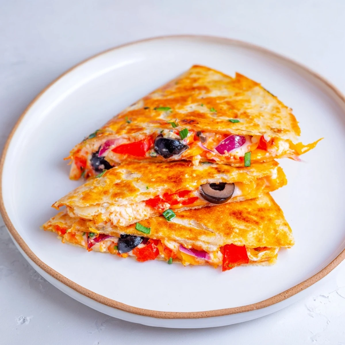 Express Snowflake Quesadillas, a golden, melty cheese delight, ready to be dipped in sour cream.