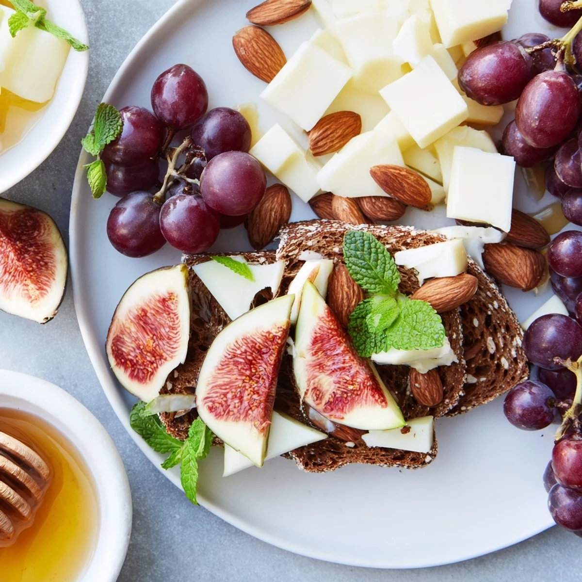 A picturesque Harvest Scythe bread and fruit platter overflowing with ripe fruits for easy sharing.