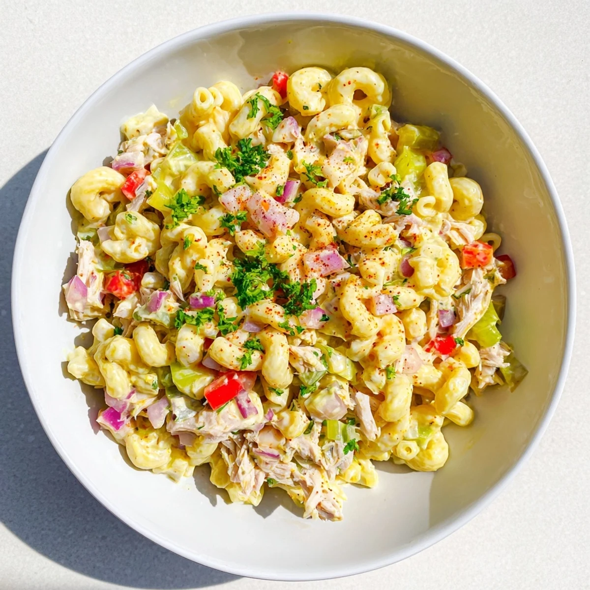 Imagine a festive bowl of cold Chicken Macaroni Holiday Salad, perfect for potlucks and holiday spreads.