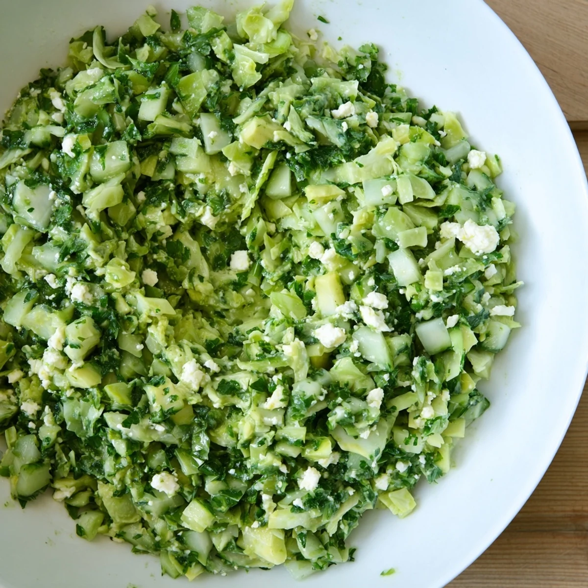 Creamy Green Goddess Cabbage Dip, a vibrant mix of fresh vegetables ready to be scooped.