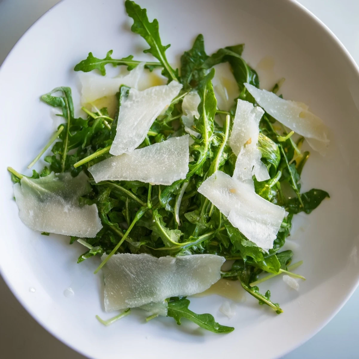 A light and zesty arugula salad with lemon dressing, ready to enjoy as a side dish.