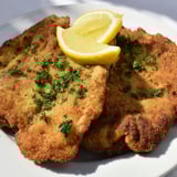 Crispy, breaded Austrian Wiener Schnitzel, a delicious and classic Austrian main course meal.
