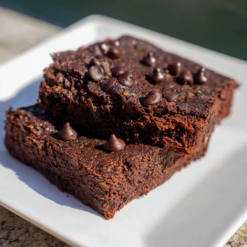 Moist, decadent sweet potato brownies with melted chocolate chips, perfect for dessert tonight.