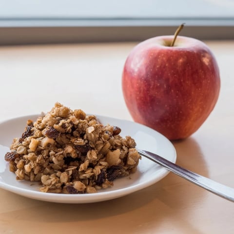 Golden-topped Baked Apples with Oat-Nut Crumble, a warm dessert ready to be enjoyed.