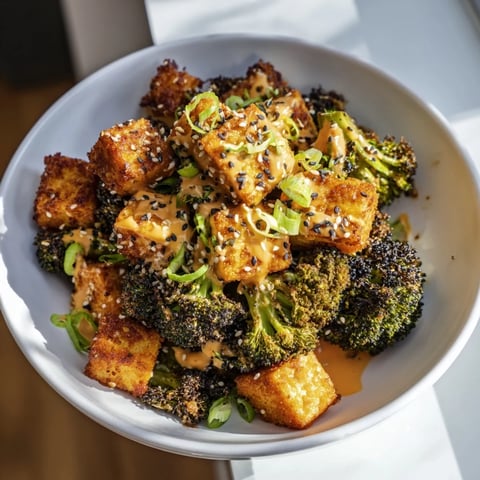 Golden-brown Cheesy Baked Tofu and Broccoli offers delightful sesame-ginger aroma after baking to perfection.