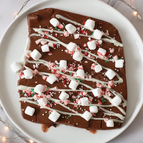 Decadent Viral Hot Chocolate Bomb Bark, a festive dessert layered with marshmallows and cocoa ready to share.