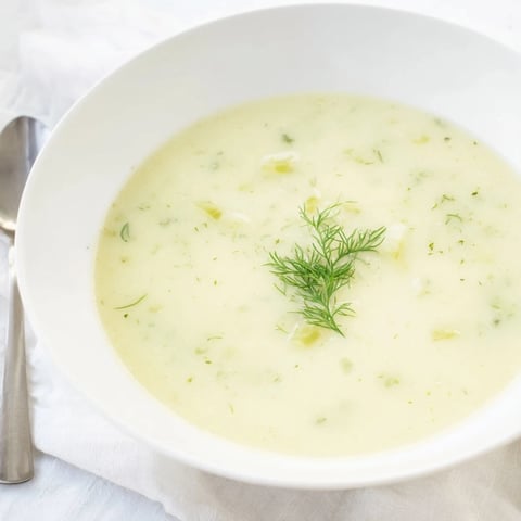 Creamy Dill Pickle Soup, a hearty, warm soup featuring visible chunks of potato and dill pickles.