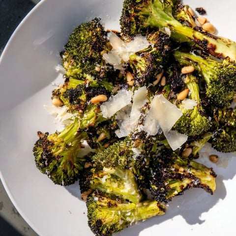 Tender, smoky Charred Broccoli Salad with Parmesan, zesty lemon dressing, ready to enjoy.