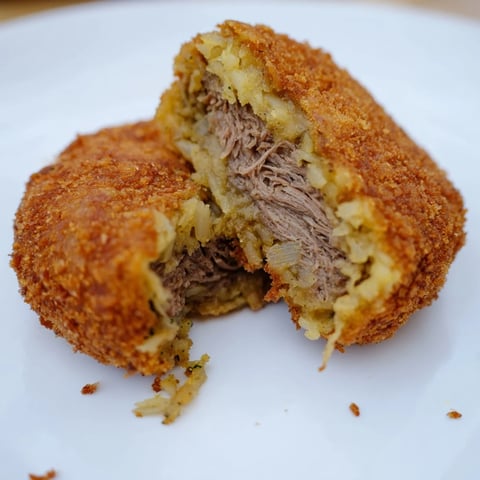 Golden, crispy Dutch croquettes with a savory beef filling, ready to serve with mustard.