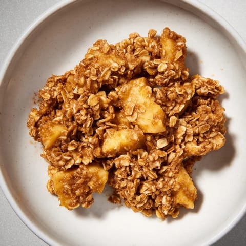 Fresh-baked Apple Crisp with juicy, tender apples under a crispy, buttery oat crumble topping.