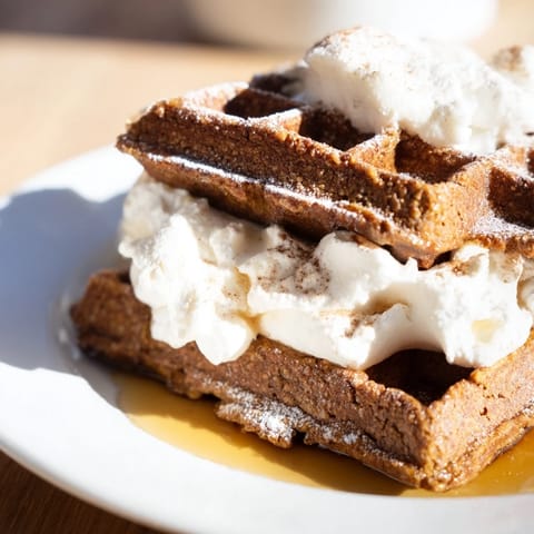 Deliciously spiced Express Gingerbread Waffle Stacks, stacked high, ready for a decadent breakfast.