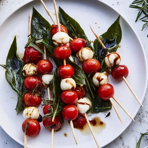 Christmas tree shaped Easy Christmas Tree Caprese Skewers arranged on a platter ready to be served as an appetizer.