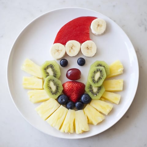 Festive Santa Fruit Platter showcasing a colorful array of fresh fruits; a healthy appetizer for the holidays.