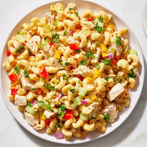 This delicious Chicken Macaroni Holiday Salad features tender chicken and macaroni, ready to enjoy cold.