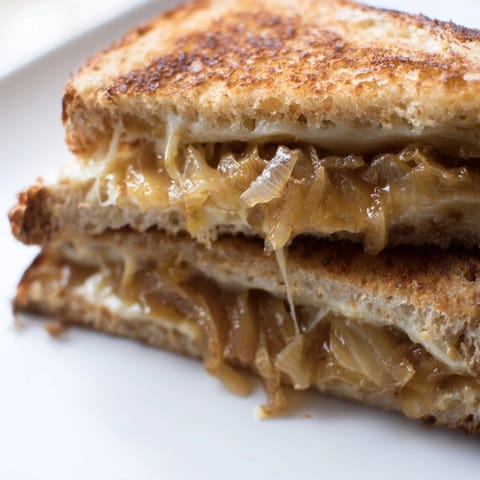 A vegetarian French-inspired sandwich, this caramelized onion and Gruyère grilled cheese is served hot, perfect with a side of tomato soup.  