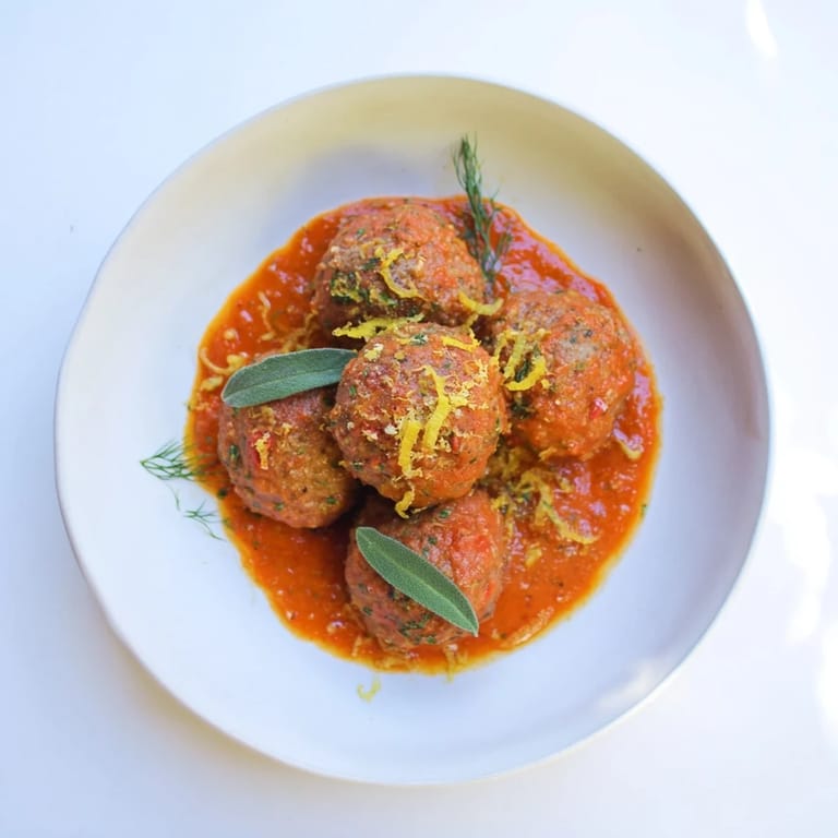 Homemade Instant Pot Greek-Style Meatballs swimming in a flavorful sauce, ideal for a satisfying family dinner.