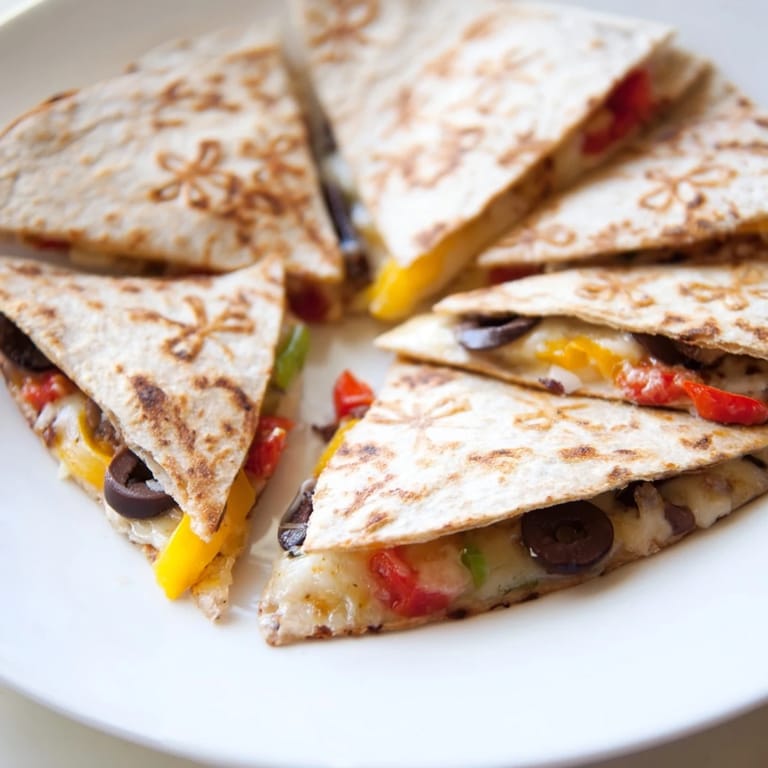 Cheesy, crispy Express Snowflake Quesadillas served with salsa, perfect for a fast, flavorful family meal.