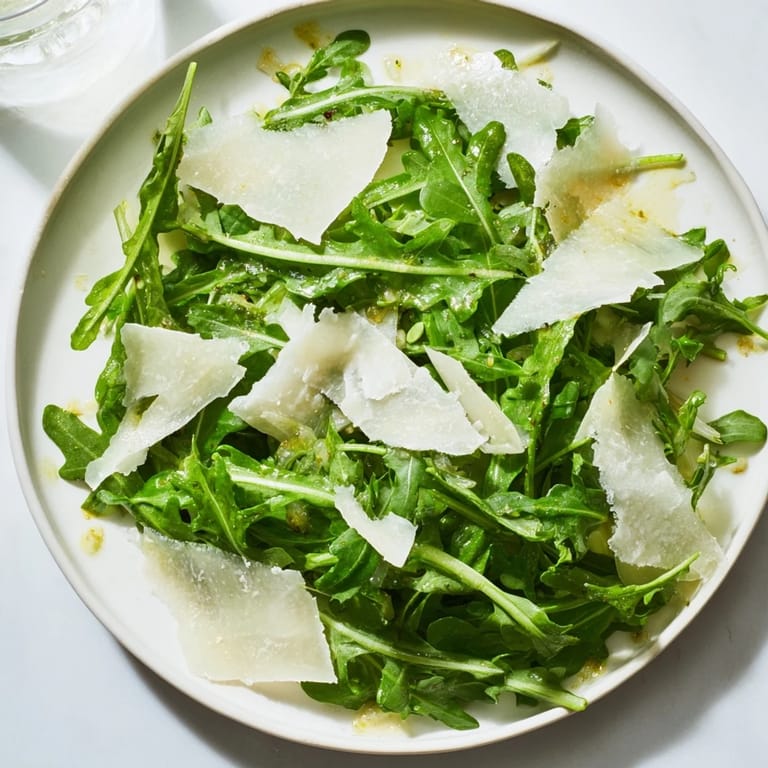 This simple arugula salad with lemon dressing looks refreshing, showcasing perfect Italian flavors.