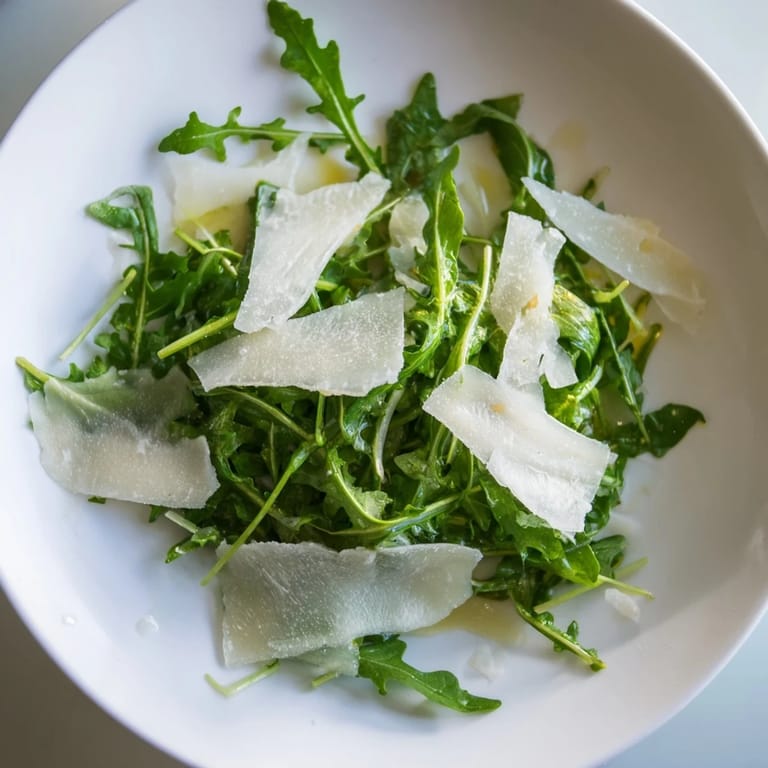 A light and zesty arugula salad with lemon dressing, ready to enjoy as a side dish.