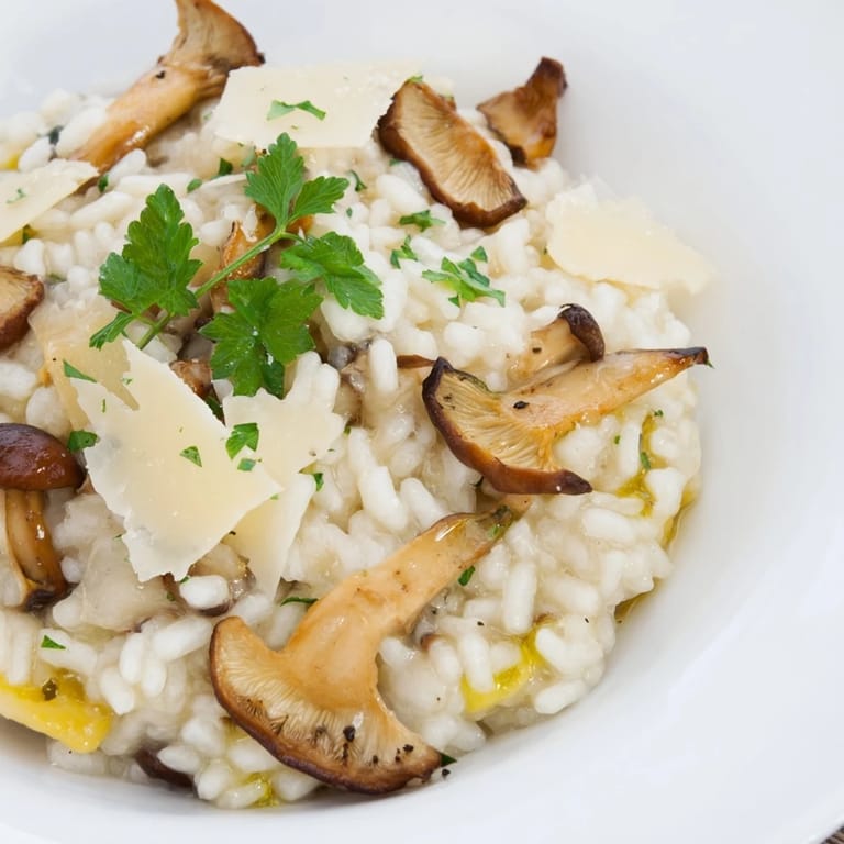 A close-up of the delicious Italian Mushroom Risotto, perfectly cooked with a rich, savory mushroom aroma.