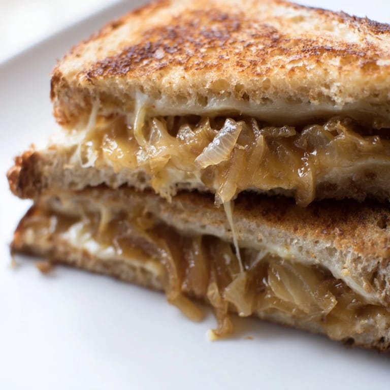 A vegetarian French-inspired sandwich, this caramelized onion and Gruyère grilled cheese is served hot, perfect with a side of tomato soup.  
