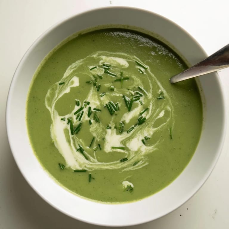 Close-up of Creamy broccoli soup, steaming and rich, with a drizzle of cream and croutons for a gluten-free lunch.